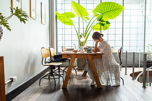 Woman is working at sweet coworking place